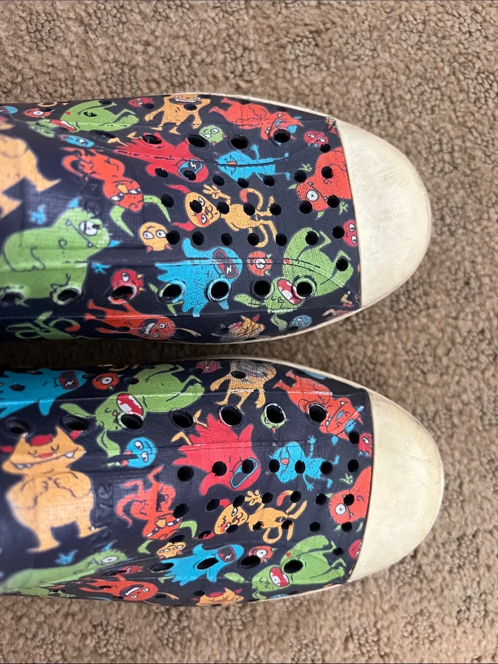 Native Kids Slip-On Shoes in Black with Multicolor Monster Print